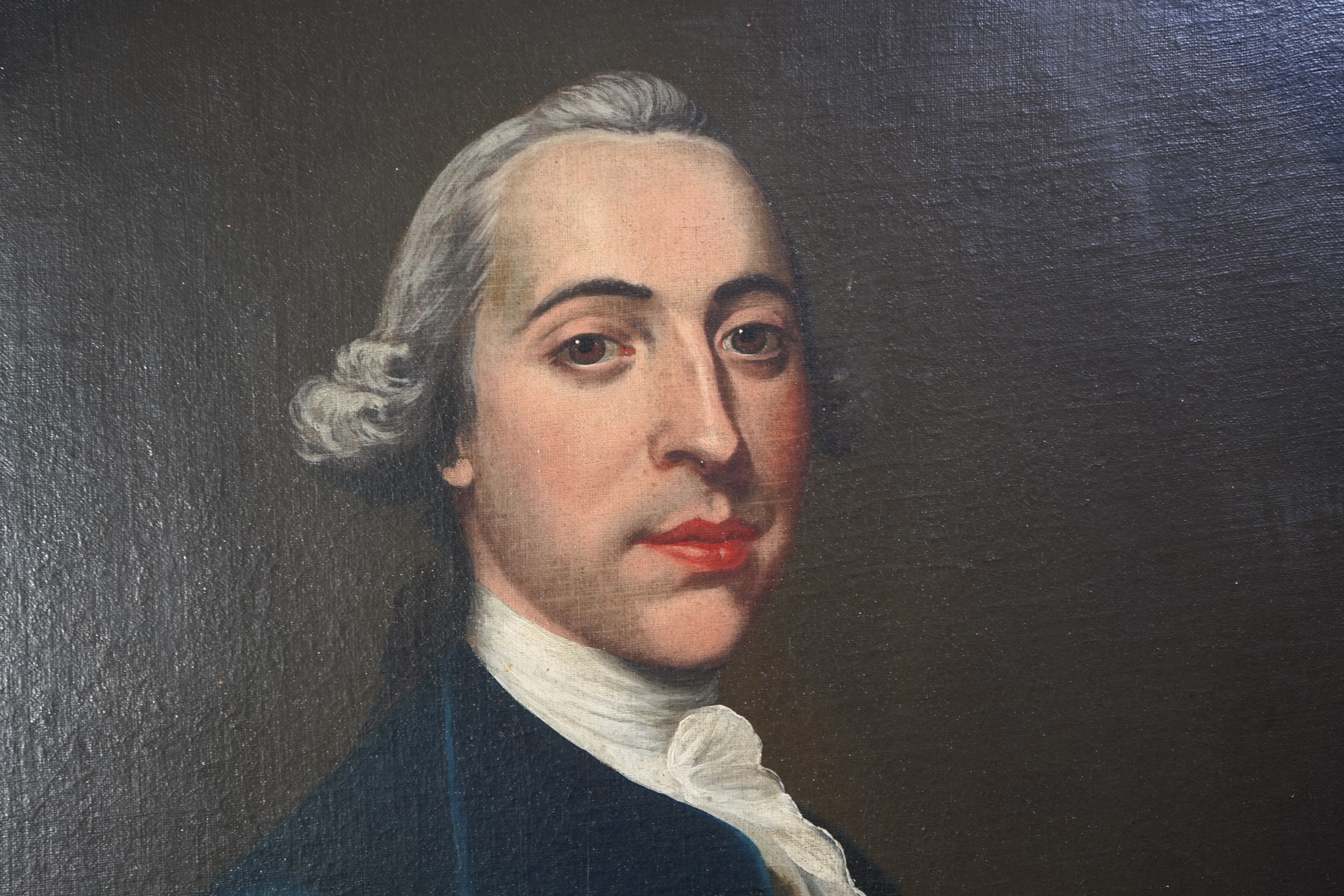 Continental School, 18th century, A portrait of a gentleman wearing a cravat and frock coat